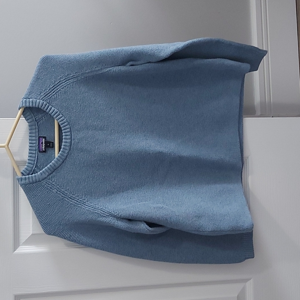 Patagonia light blue sweater.  100 % organic cotton exclusive of trum.